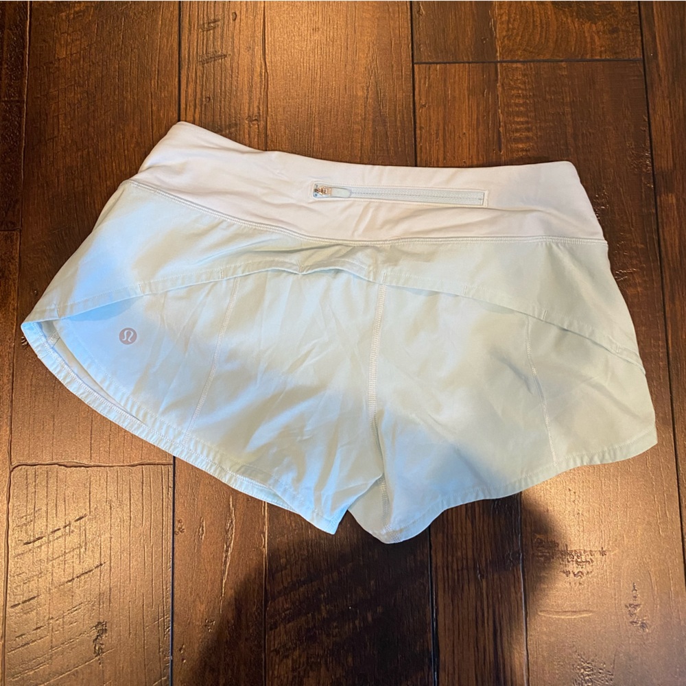 Lululemon “Run Speed Up Low-Rise Lined Short 2.5” in turquoise color.